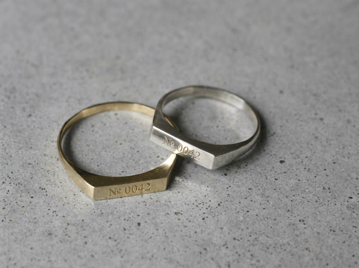 The Simple Bond pair, 18K yellow gold and platinum, engraved with mock Bond № 0042
